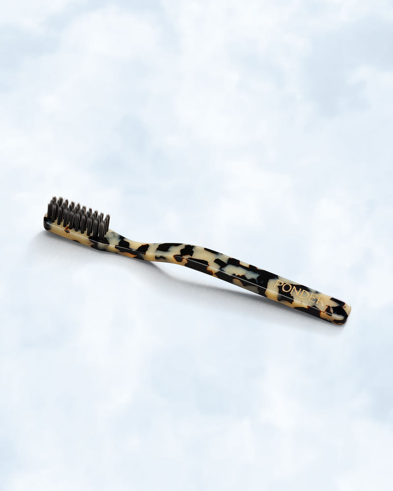Soft charcoal toothbrush · Black/White