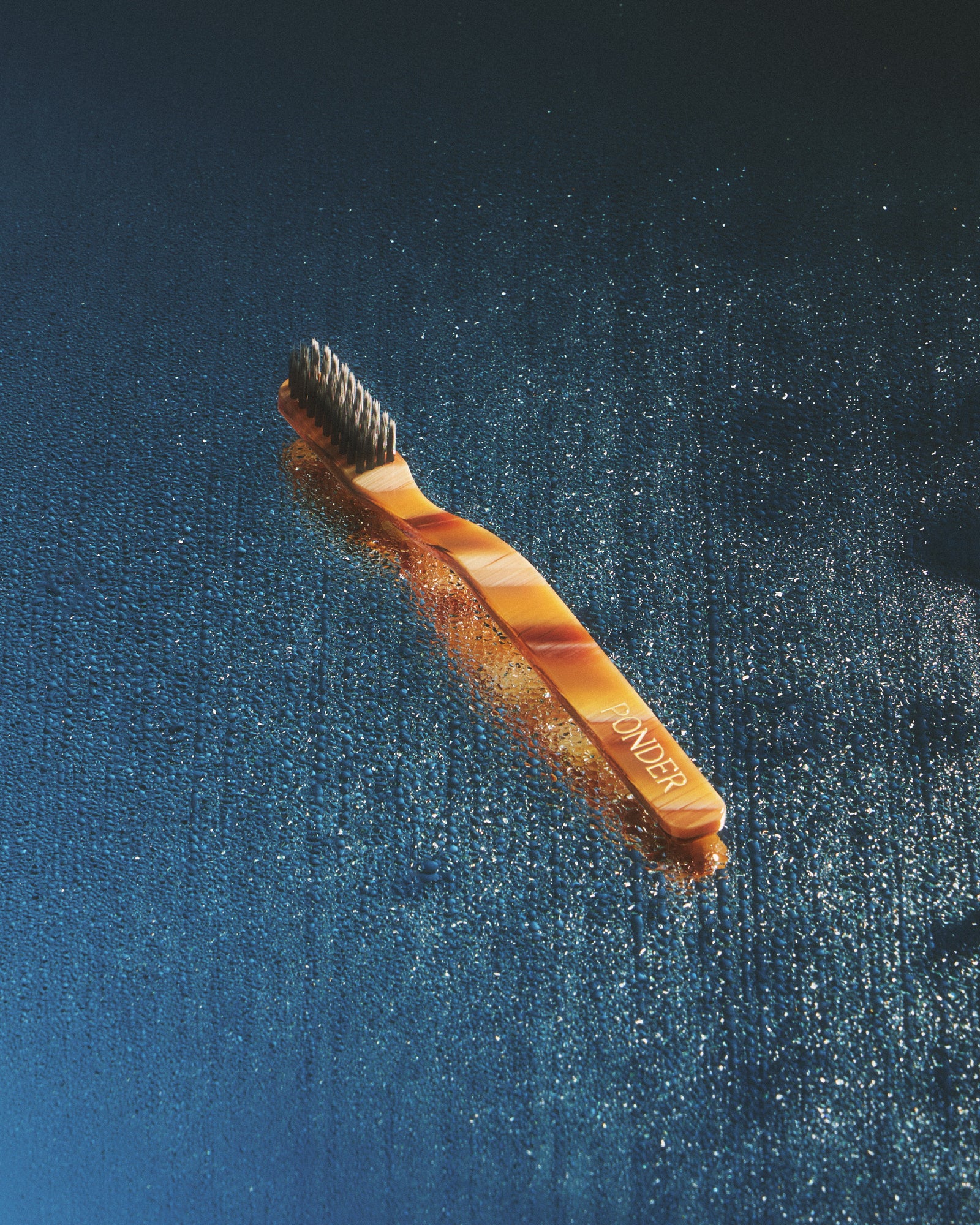 Soft charcoal toothbrush · Brown