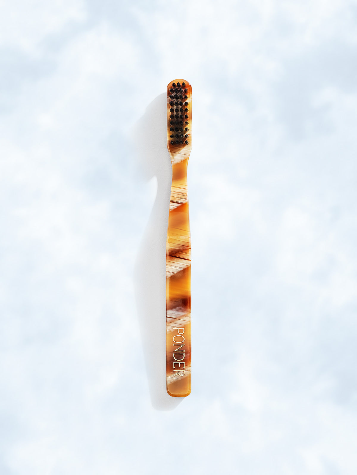Soft charcoal toothbrush · Brown